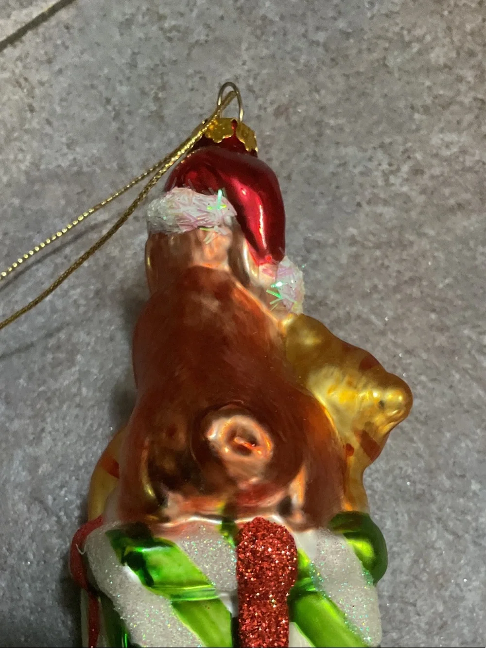 Glass Dog Ornament Sitting on Stacked Presents - Brown, Gold, Green